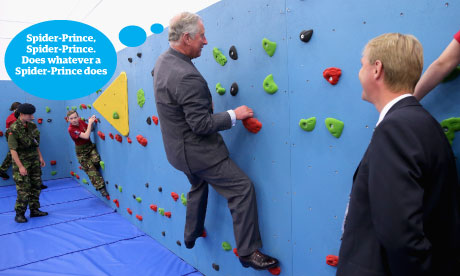 Prince Charles tries out the climbing wall