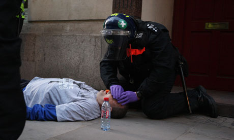 Ian Tomlinson on ground