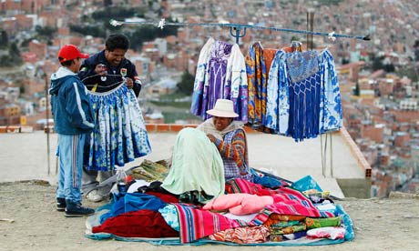 An Aymara woman sells clothes in the market of El Alto on the outskirts of La Paz