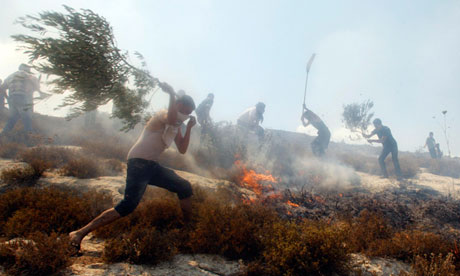 Palestinian villagers and firefighters