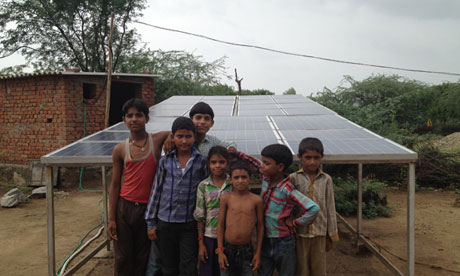 Children in Khareda Lakshmipura, Rajasthan, with the Gram Power installation 