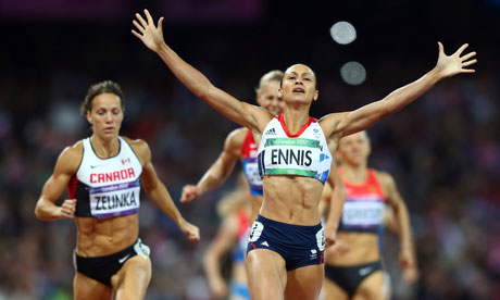 Jessica Ennis crosses the finish line in the 800m to take gold in the women's heptathlon.
