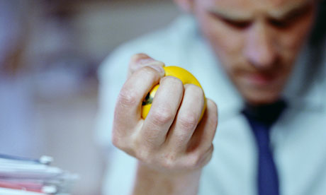 Man squeezing stressball