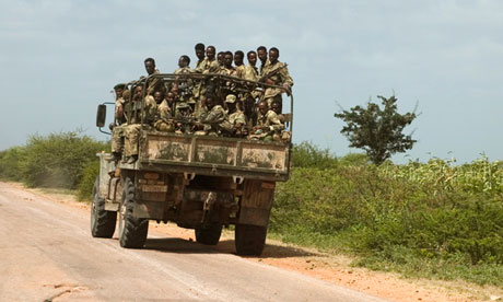 Ethiopian soldiers ride an army vehicle