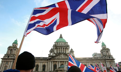 Loyalist protesters hold union flags outside Belfast City Hall