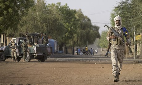 A Malian soldier walking in Gao