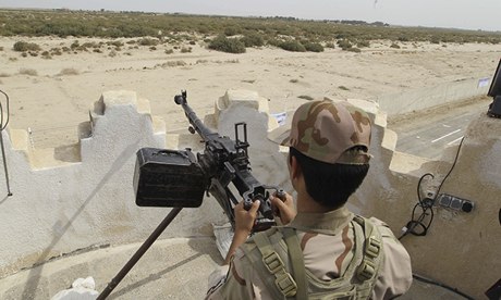 An Iranian border guard keeps watch