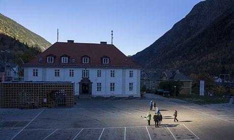 People gather in front of the town hall of Rjukan,