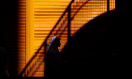 Indonesian woman walks along Hong Kong street