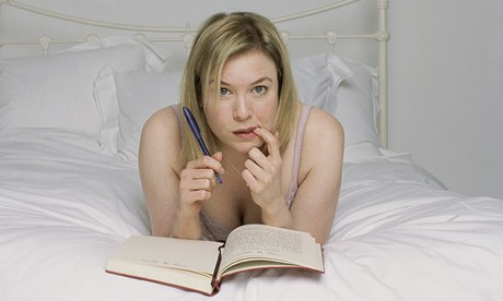 Renée Zellweger as Bridget Jones, lying on bed and looking up writing diary