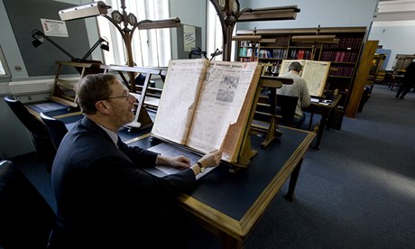 A reader looks at a copy of the Yorkshire Post at the Colindale archive