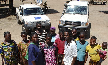 Midwife Olga Yetikoua, front, left, with TV presenter Seyi Rhodes