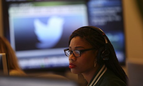 A Twitter employee works at a computer 