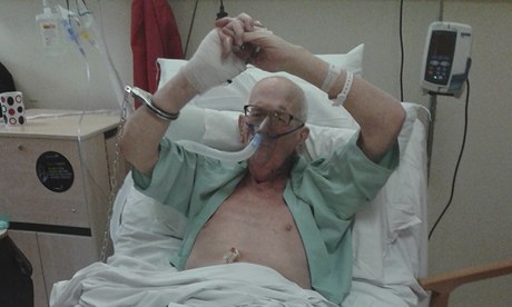 Michael Tyrrell handcuffed to his hospital bed the day before he died. His daughter took the photo