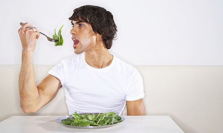 Man eating greens