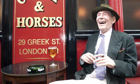Peter O'Toole laughing outside pub
