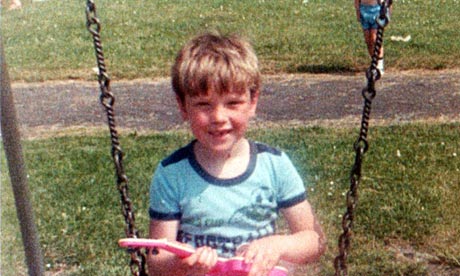 A young Damian Barr on a swing.