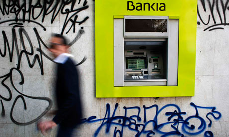 Bankia bank branch with graffiti on it in Madrid