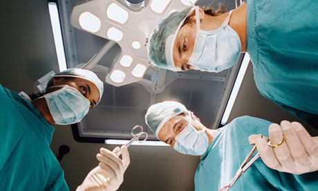 Surgeons looking down on patient