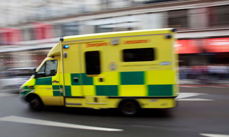 Ambulance passes at high speed in central London.