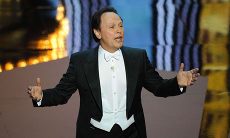 Billy Crystal in tuxedo hosting the 2012 Oscars ceremony