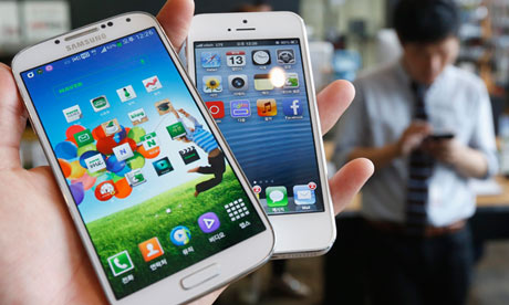File photo of an illustration of Samsung Electronics' Galaxy S4 and Apple's iPhone 5 in Seoul
