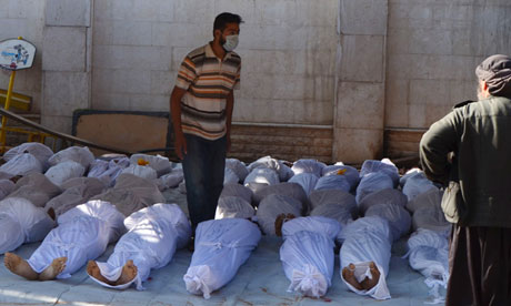 Bodies laid out after the attack on the rebel-held Ghouta suburb