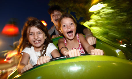 Children on a rollercoaster ride at Luna Park, Athens. 