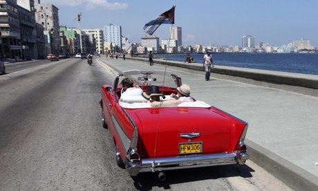 Tourists ride a 1957 Chevrolet Bel Air convertible on Havana’s seafront boulevard ‘El Malecón’.