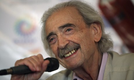Juan Gelman, Argentinian poet, with microphone at a conference 