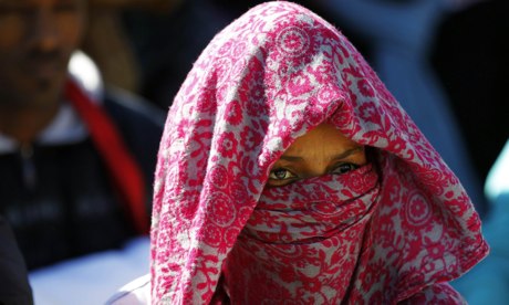 An African migrant takes part in a protest opposite the Knesset