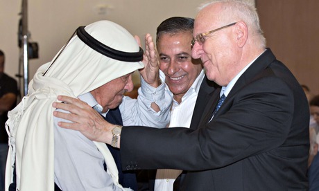 Israeli president Reuven Rivlin greets an Arab-Israeli at a memorial for Kafr Qasim massacre
