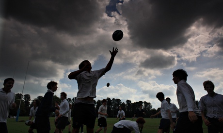 Boys of Eton College play rugby