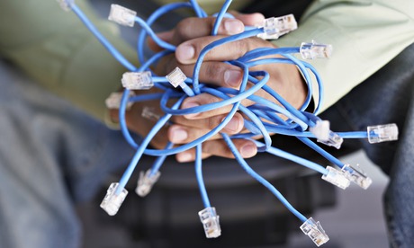 Closeup of hands holding Ethernet cables