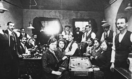 Tailoring workers in a sweatshop in the East End of London, in the 1920s