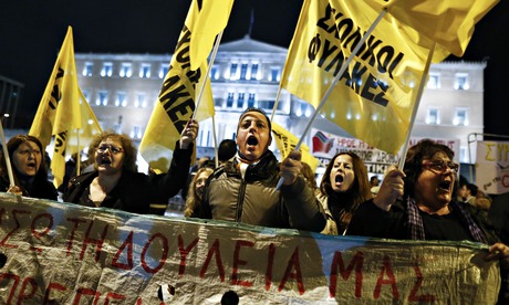 Anti-austerity protesters gather outside parliament in Athens on Sunday.