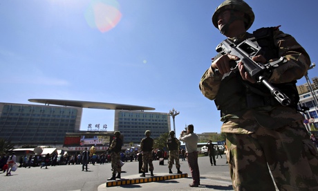 Police stand guard outside Kunming railway station