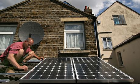 man installing solar panels