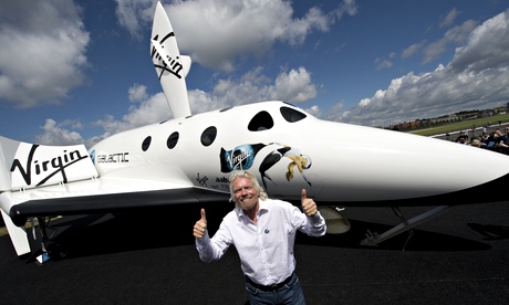 Richard Branson with model of Virgin Galactic rocket