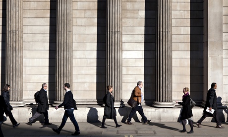 City workers outside the Bank of England building on Threadneedle Street in the City of London. 