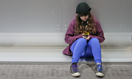 young girl texting cell phone sitting alone