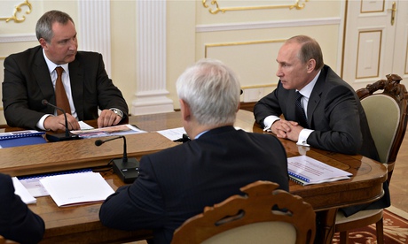 Vladimir Putin and deputy prime minister Dmitry Rogozin, left