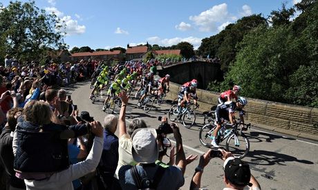 The leading riders pass over the bridge in West Tanfield, Yorkshire, in the 2014 Tour de France.