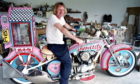 Grayson Perry with his bike Patience at his studio in East Sussex.  