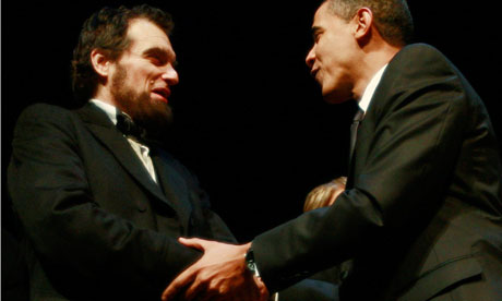 President Obama greets an actor portraying former president Lincoln