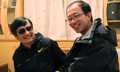 blind Chinese legal activist Chen Guangcheng and friend and fellow activist Hu Jia in April 2012