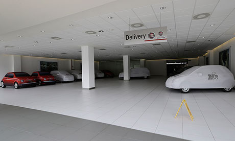 A Milan car dealer's empty delivery bay. Car sales have crashed in Italy