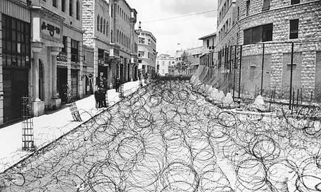 Barbed wire to separate Arabs and Jews covers Princess Mary Avenue in Jerusalem in May 1948