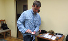 Ryan Fogle after his arrest by the FSB, with items he was said to be carrying, such as wigs, cash