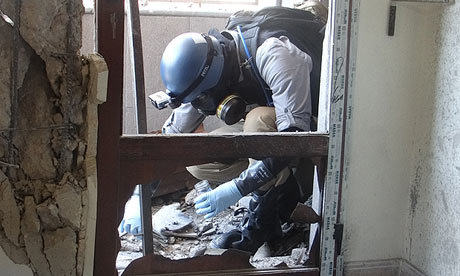 A UN chemical weapons inspector takes samples from one of the sites in Damascus 